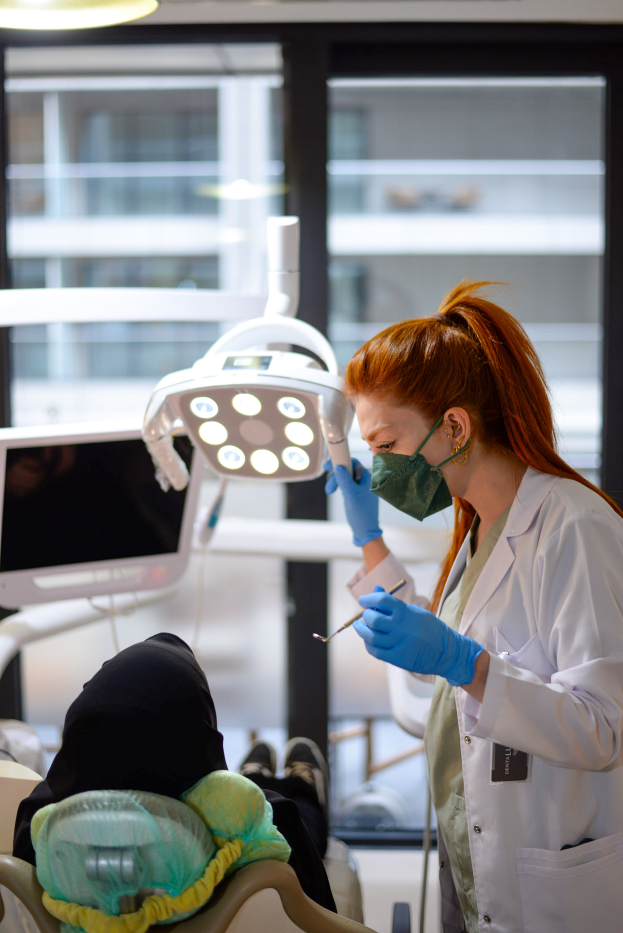 Dentist preparing for a comfortable patient examination